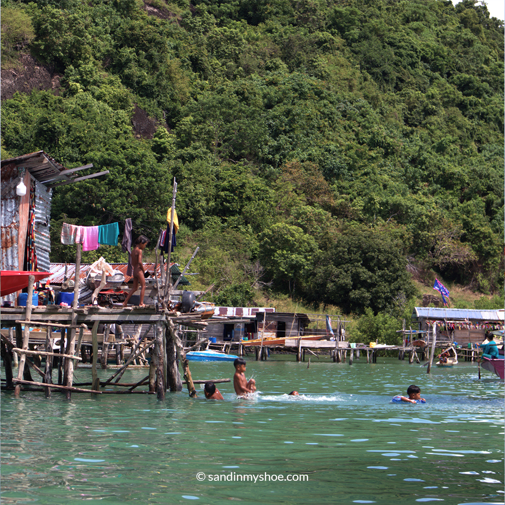 Children from the Sea Gypsy Malaysia community playing in the sea