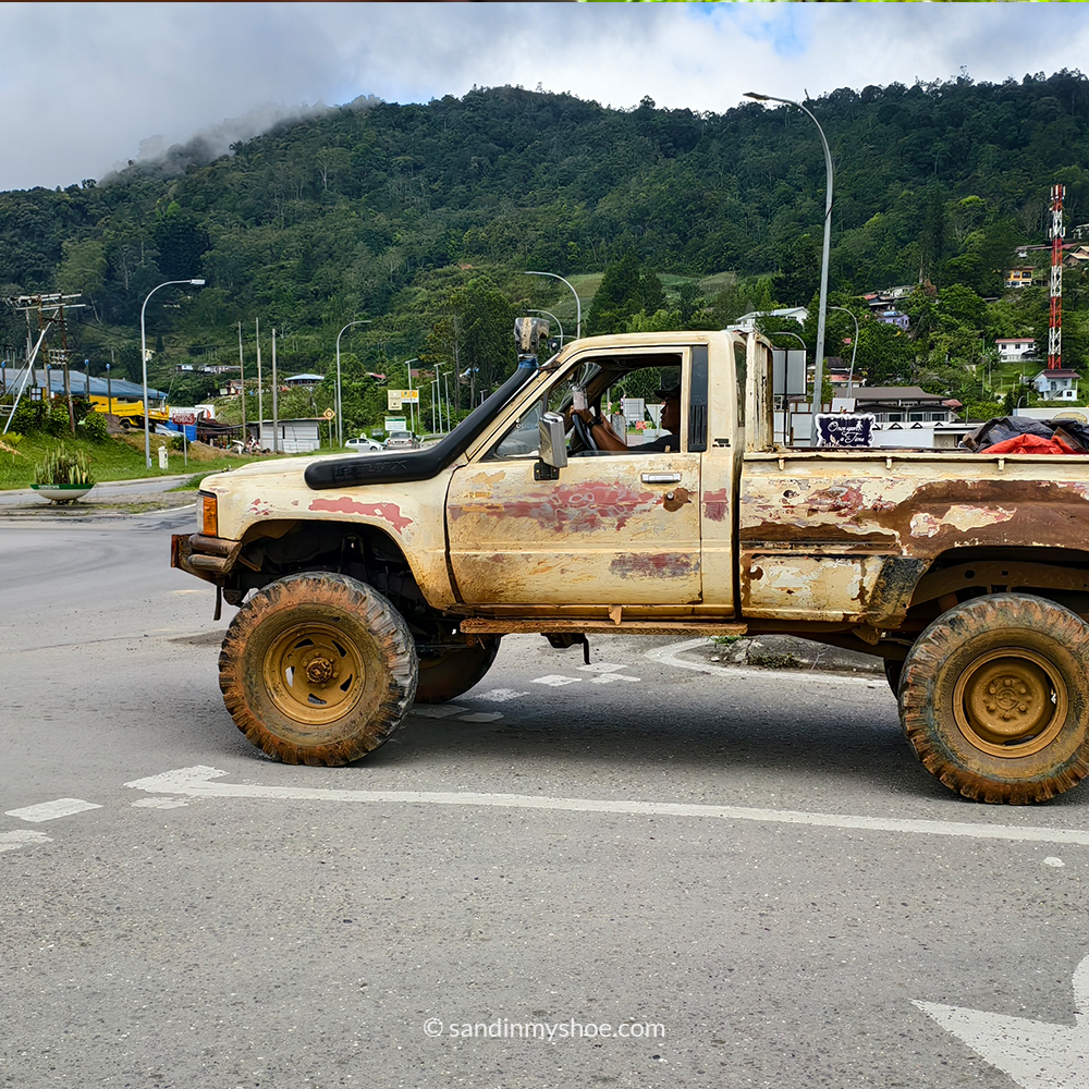 Rusty old truck parked near the fields in Kundasang