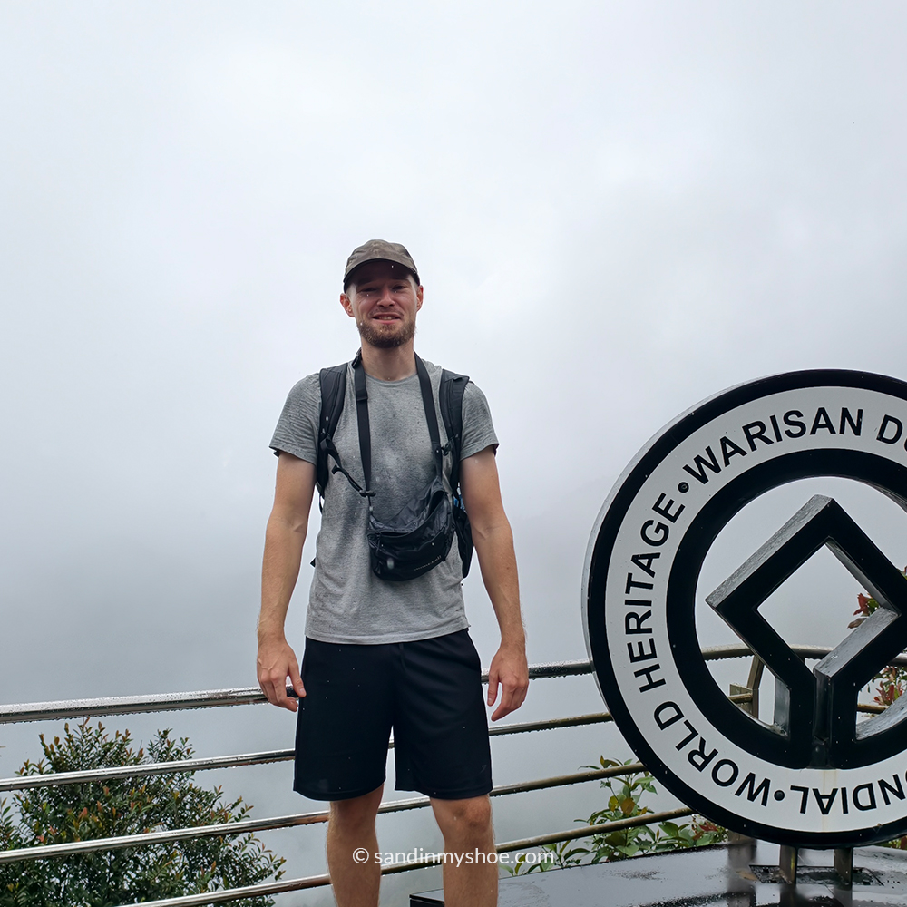 Petteri posing with misty mountains from Kinabalu National Park
