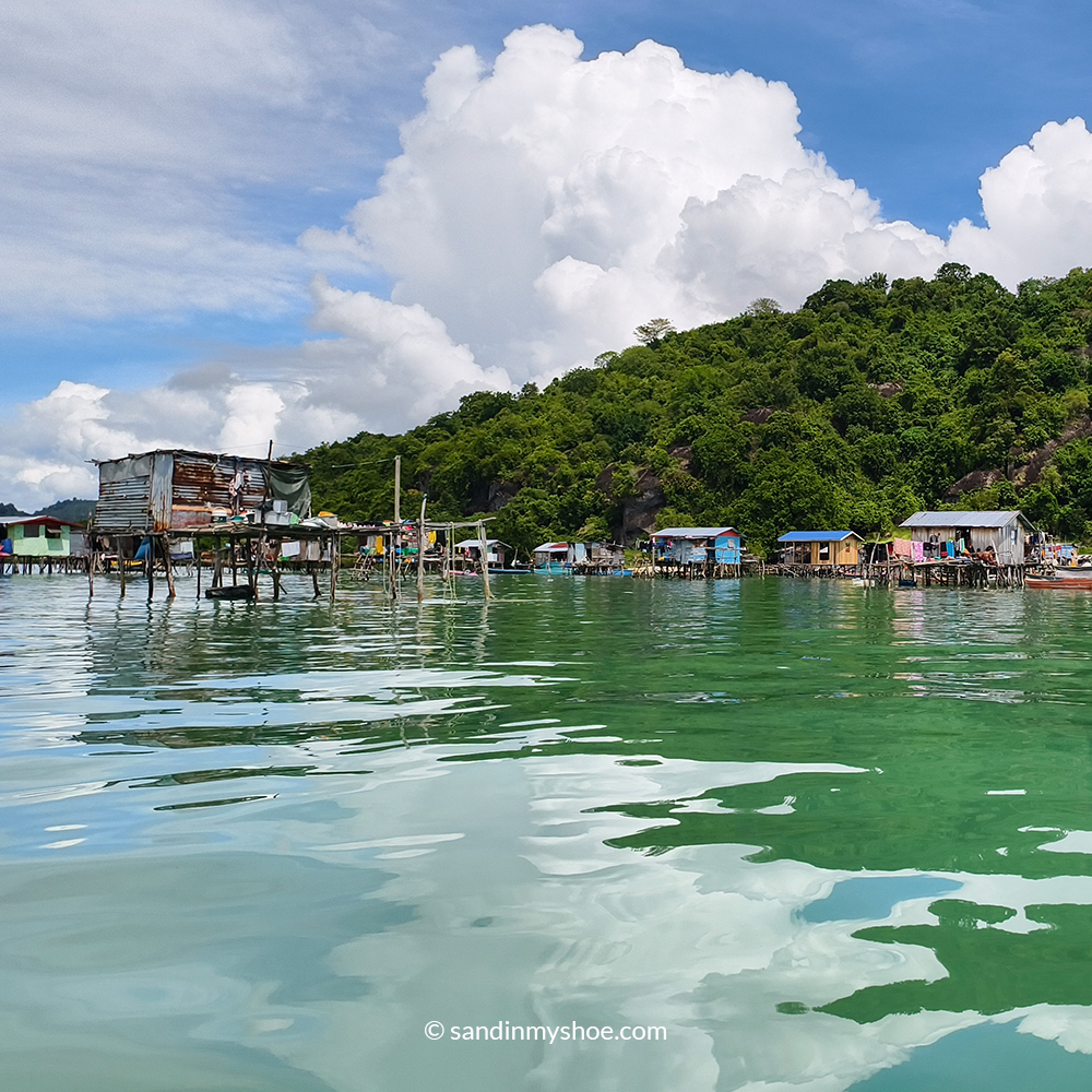 Stilt houses over clear water in a Sea Gypsy Malaysia village