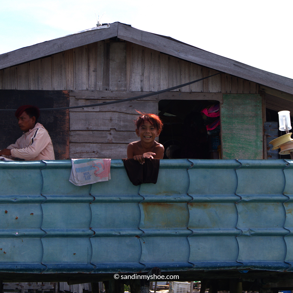 Bajau laut boy smiling widely