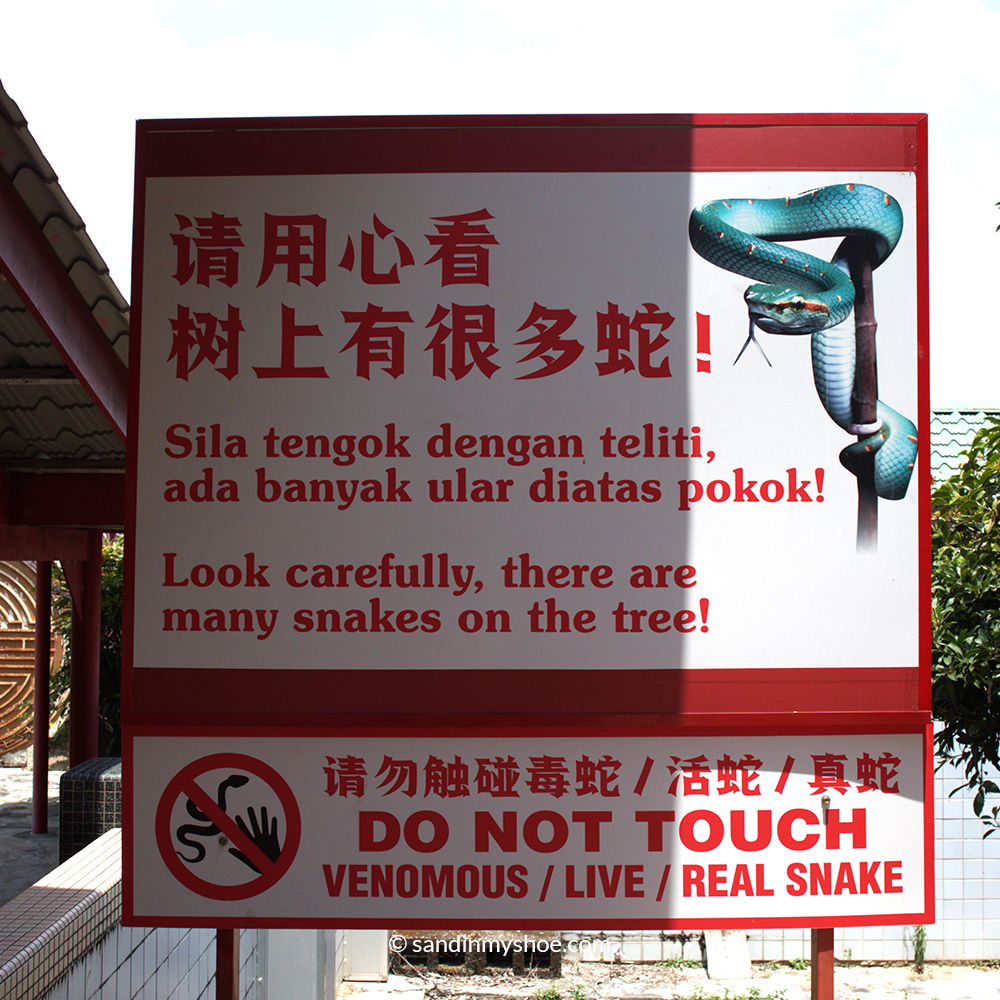 Warning sign of poisonous snakes in the Snake Temple. One of top unusual things to do in Penang.