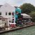 Tranquil view of Melaka River lined with colorful cafe