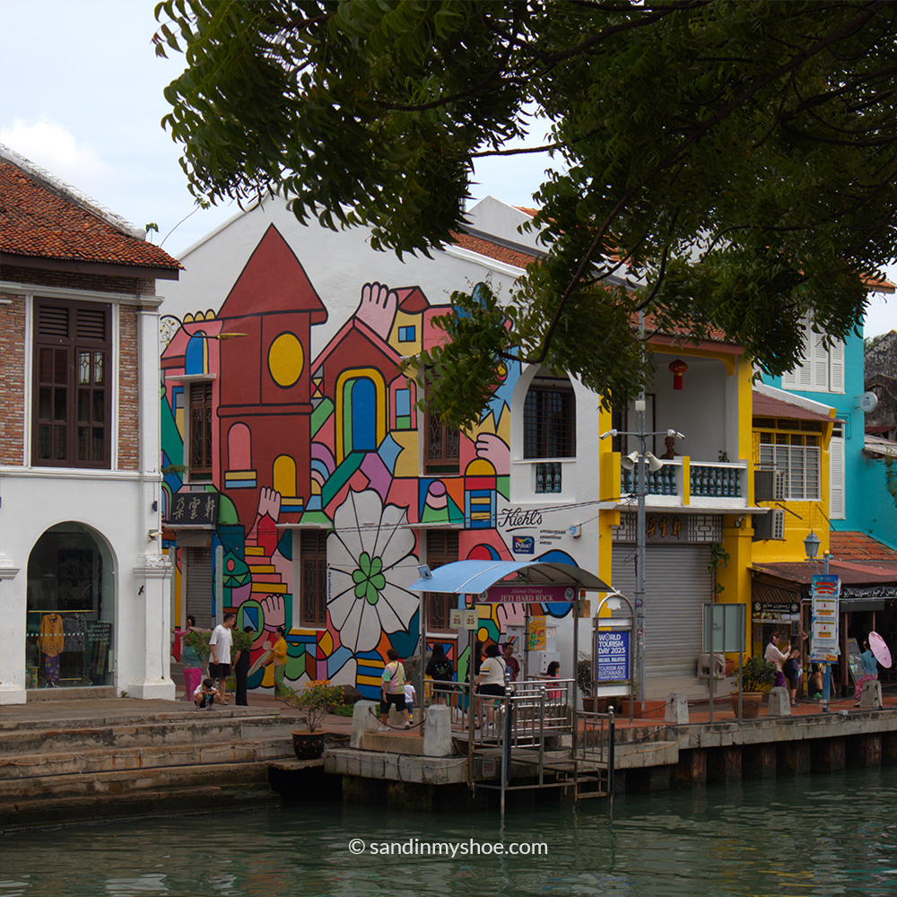 Colorful mural by the Melaka River, where the Malacca itinerary begins