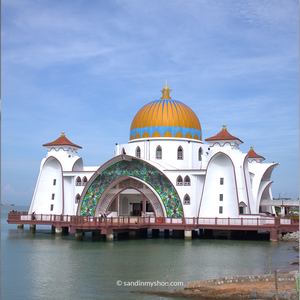 Masjid Selat, the floating mosque of Malacca, at the water’s edge during daylight