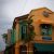 Bright yellow colonial-era building with ornate architectural details in Malacca
