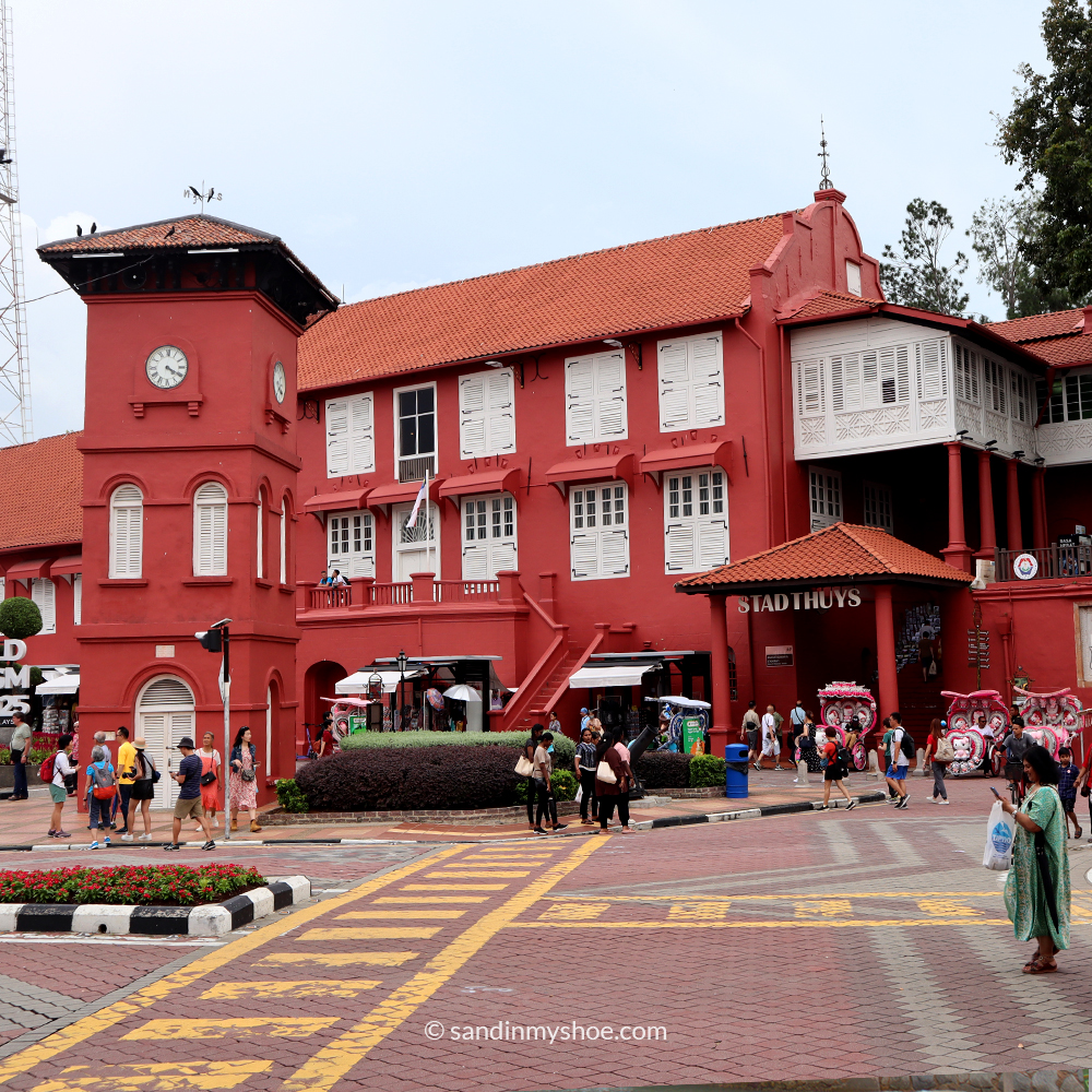 Dutch Square featuring the red clock tower and surrounding heritage architecture