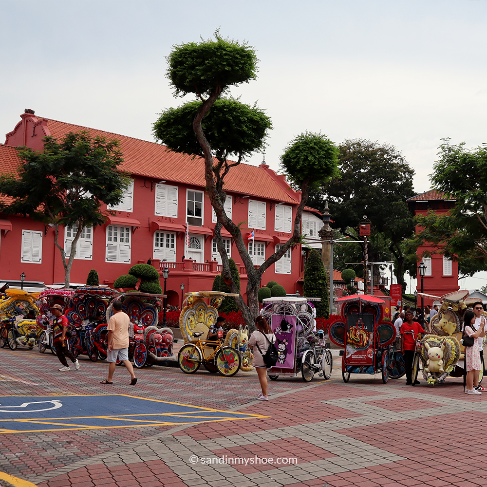 View of Dutch Square in Malacca with iconic red colonial buildings and Christ Church