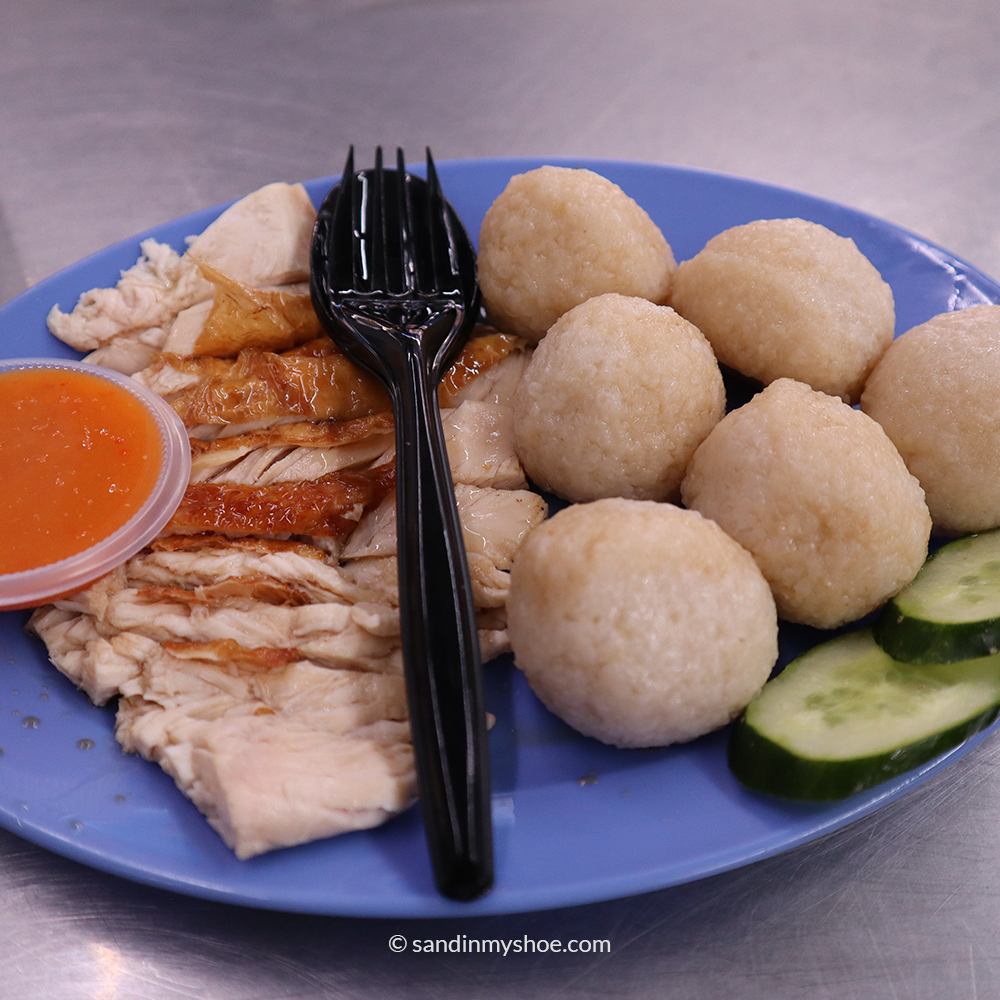 Traditional Malaccan chicken rice balls served with sliced chicken and spicy sauce