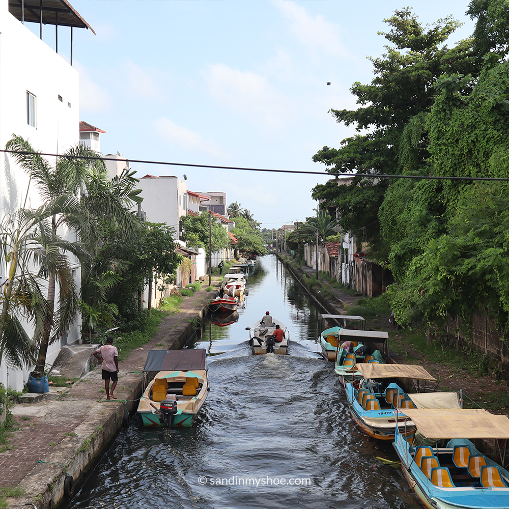 Boat cruising the canals of Negombo — a peaceful activity that shows what Negombo is like