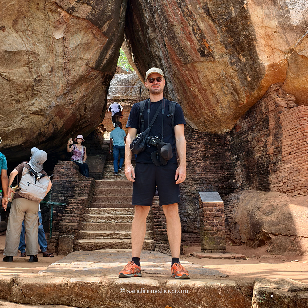 Petteri hiking through boulders on a Sigiriya hikes trail near Pidurangala.