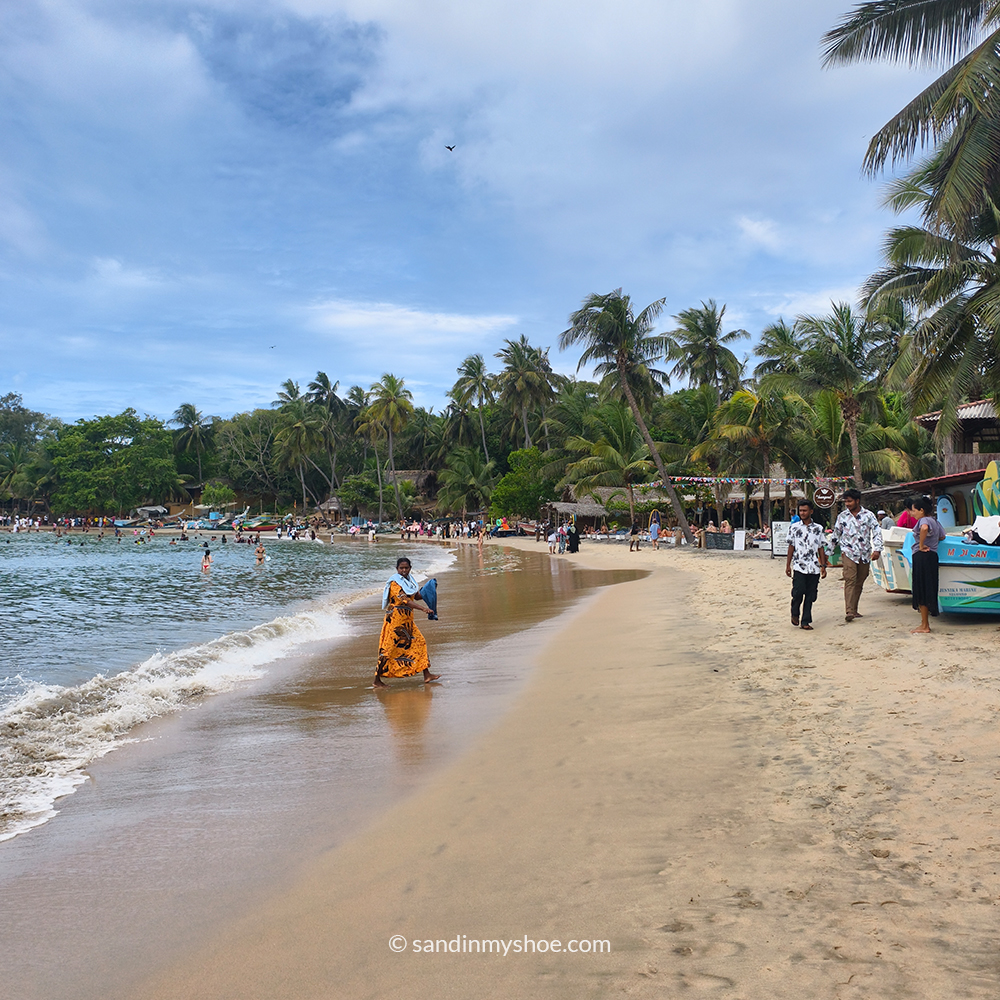 Golden sand and waves at Arugam Bay, a key destination on a Sri Lanka tuk tuk itinerary along the coast.