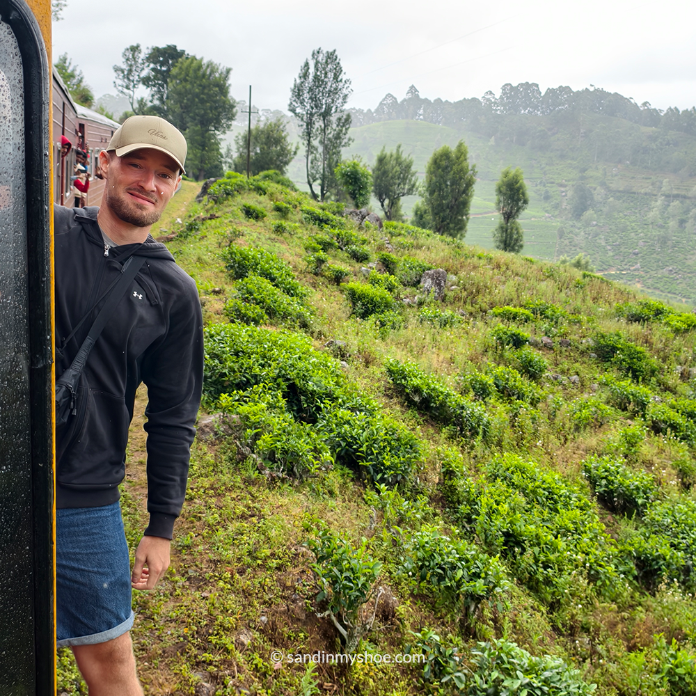 Petteri hanging from a moving train, a classic Sri Lankan experience included between tuk tuk route segments.