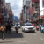 Bustling Sri Lankan traffic scene with tuk tuks and buses, capturing the intensity of driving on a Sri Lanka tuk tuk route.