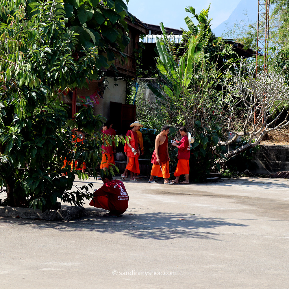Monks walking in orange robes in Chiang Mai, Thailand – one of the top Southeast Asia places to go.