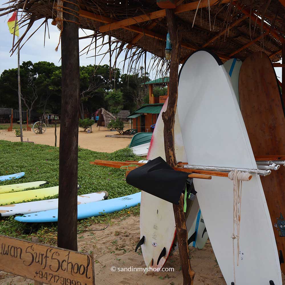 Surfboards on the beach in Arugam Bay, Sri Lanka — an activity that won’t break your travel budget