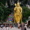 Petteri in front of Batu Caves’ rainbow staircase and towering Lord Murugan statue — a vibrant reason why Kuala Lumpur is worth visiting.
