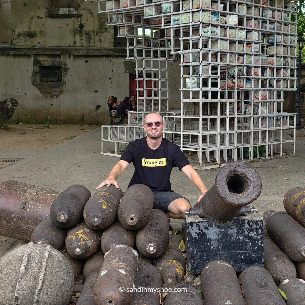 Petteri standing beside colonial-era cannons in Intramuros