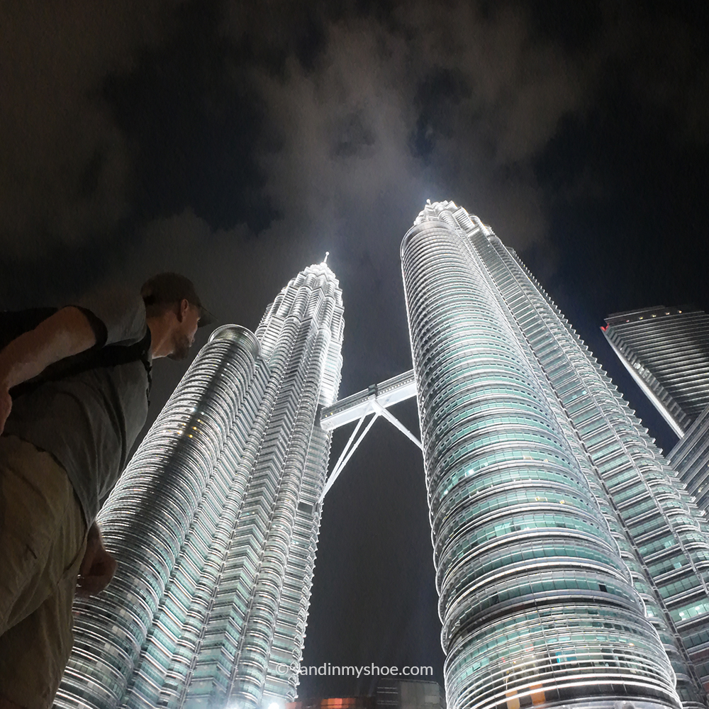 Petteri standing beneath the Petronas Twin Towers — a striking highlight that answers the question: is Kuala Lumpur worth visiting?