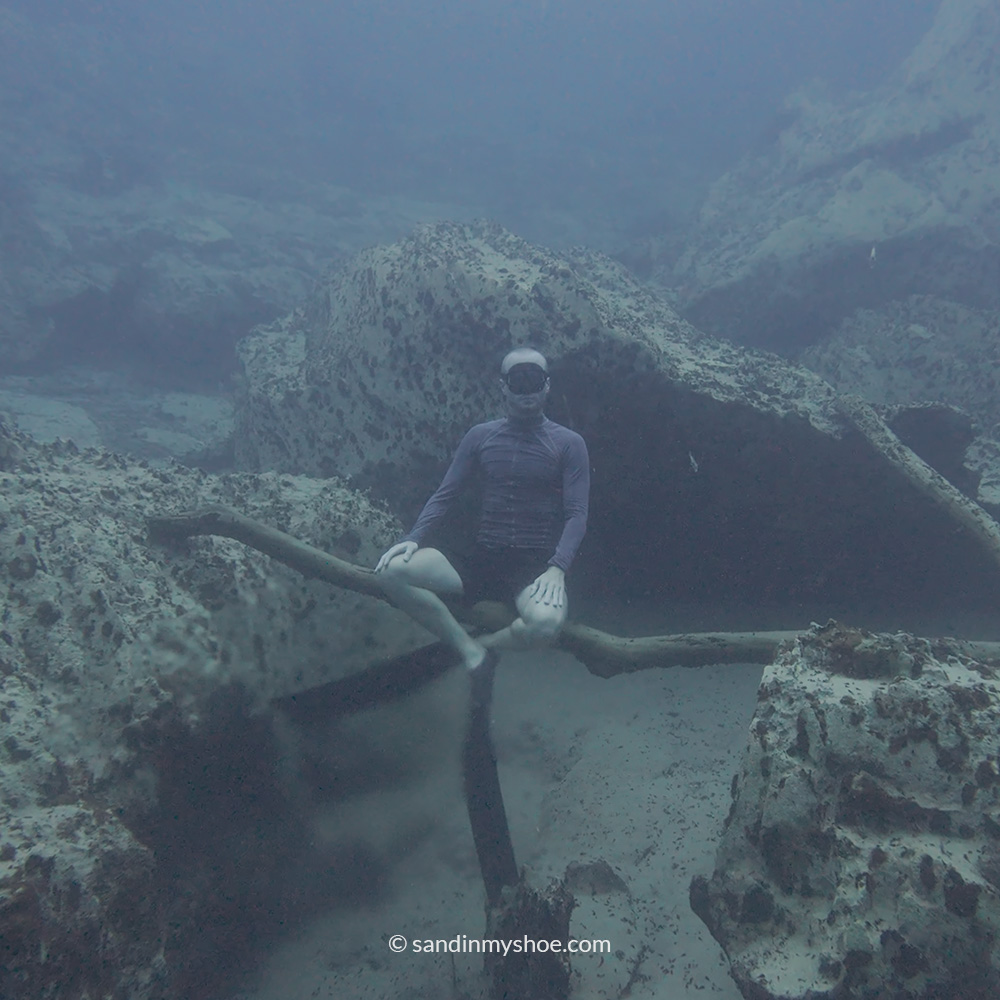 Petteri diving at the bottom of Barracuda Lake, experiencing the surreal underwater beauty that makes travel Southeast Asia so unforgettable.