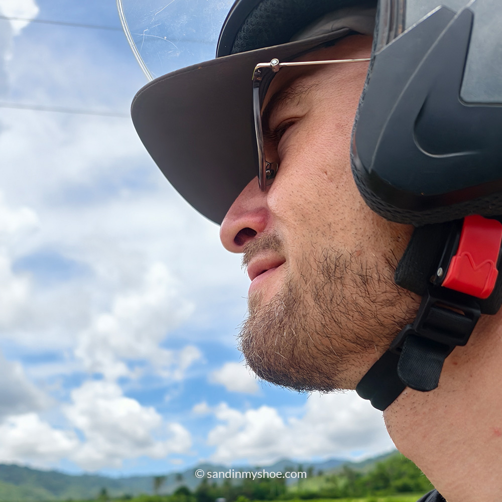 Sideshot of Petteri on a motorbike — one of the best ways to travel Southeast Asia
