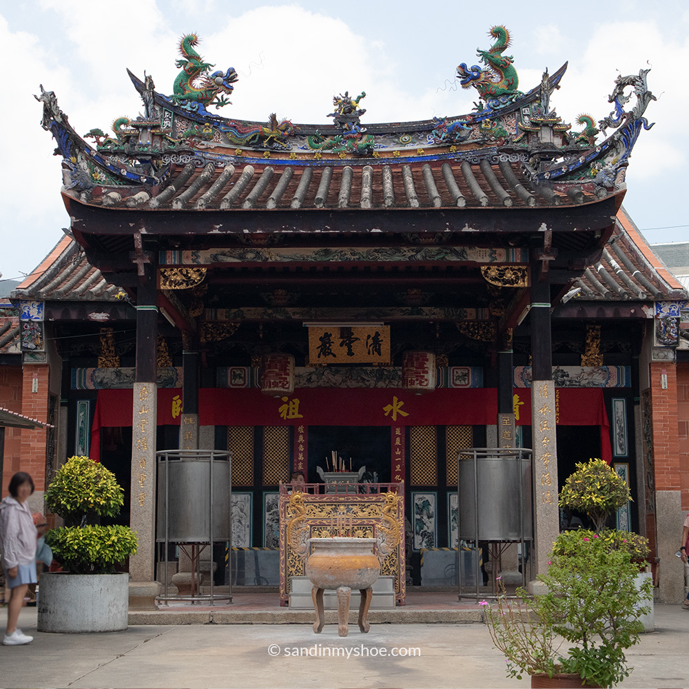 Main entrance of the Snake Temple in Penang, featuring traditional Chinese architectural elements with incense burner placed centrally.