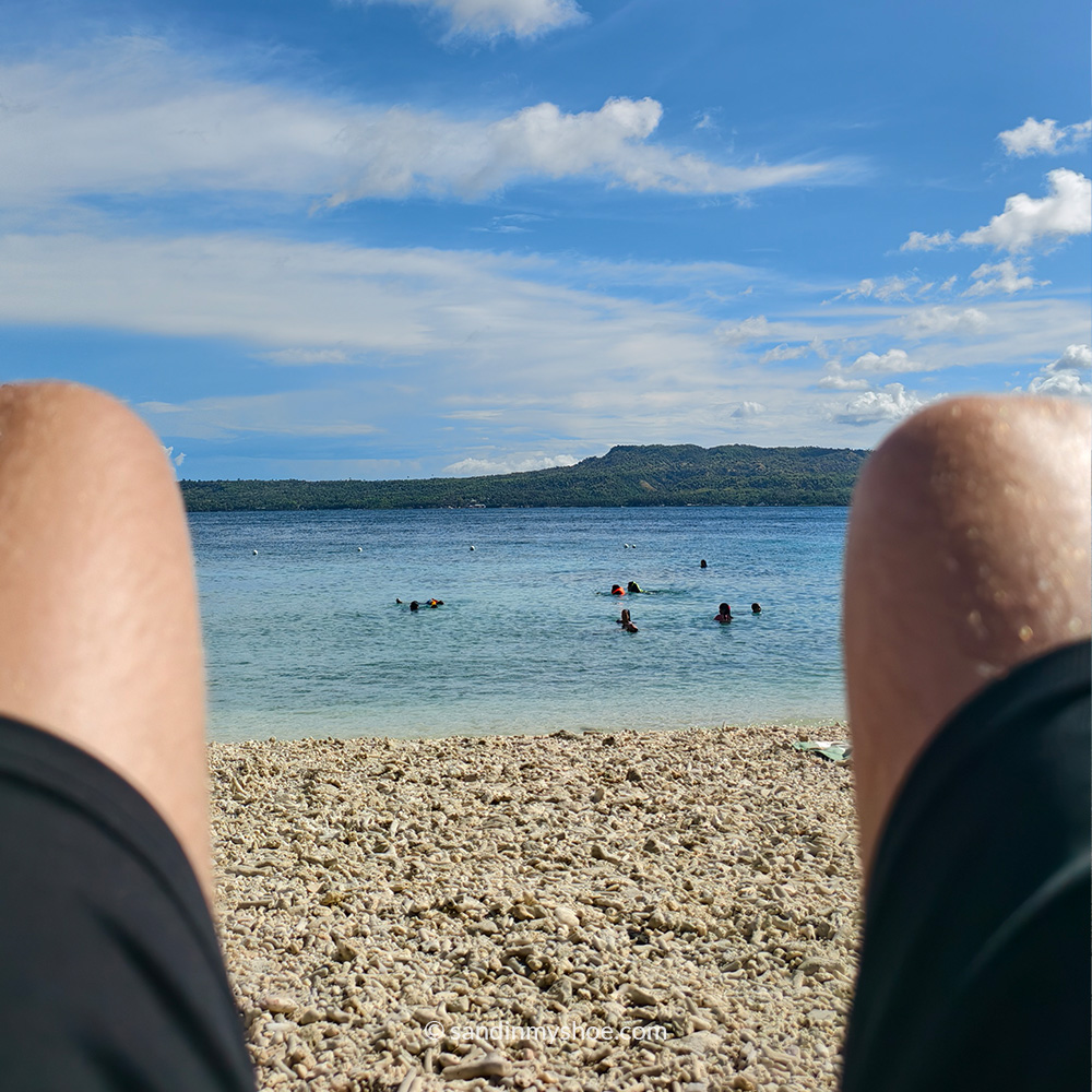 Me getting a unvoluntary back massage from the rocky beach.
