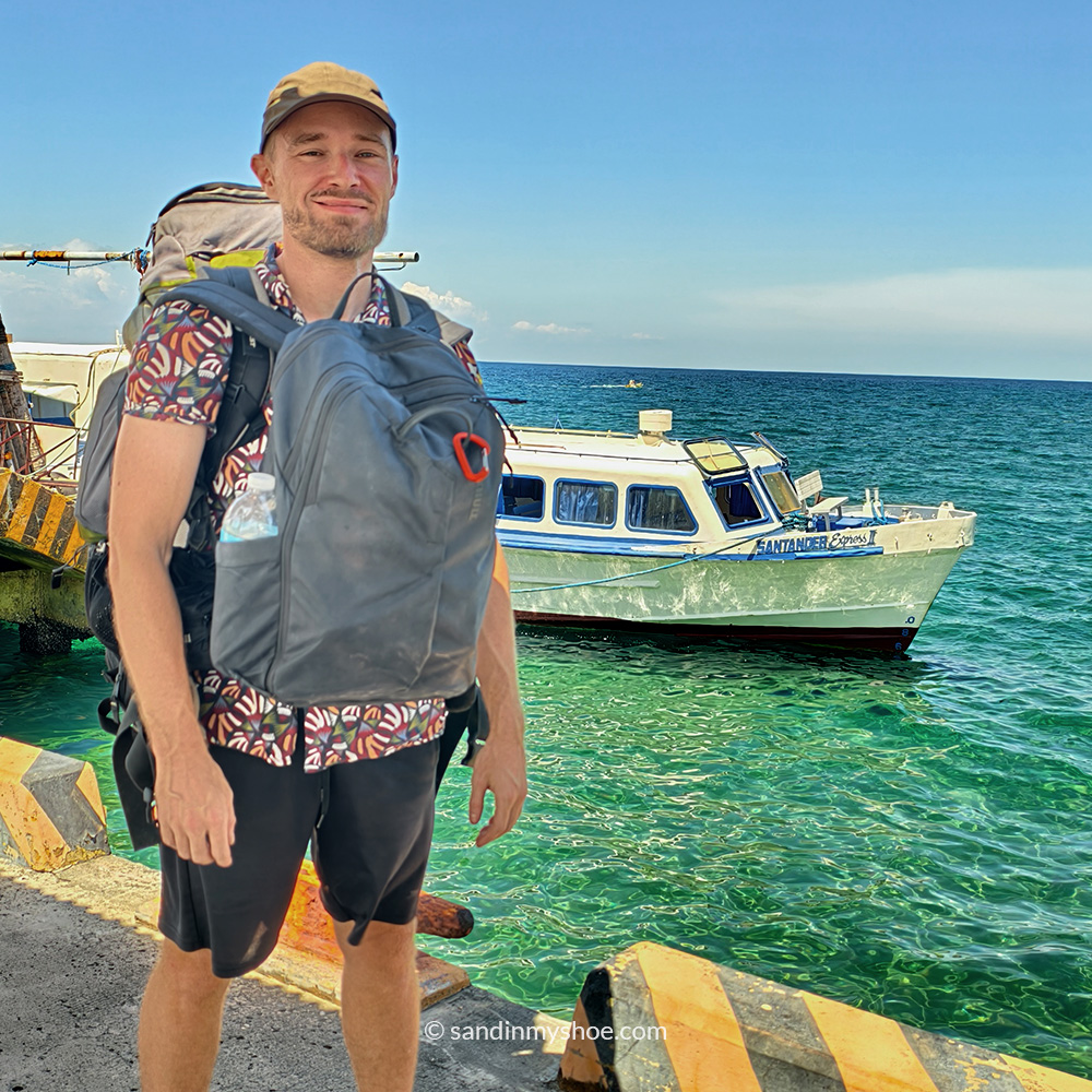 Traveler posing in front on the boat at Liloan Port