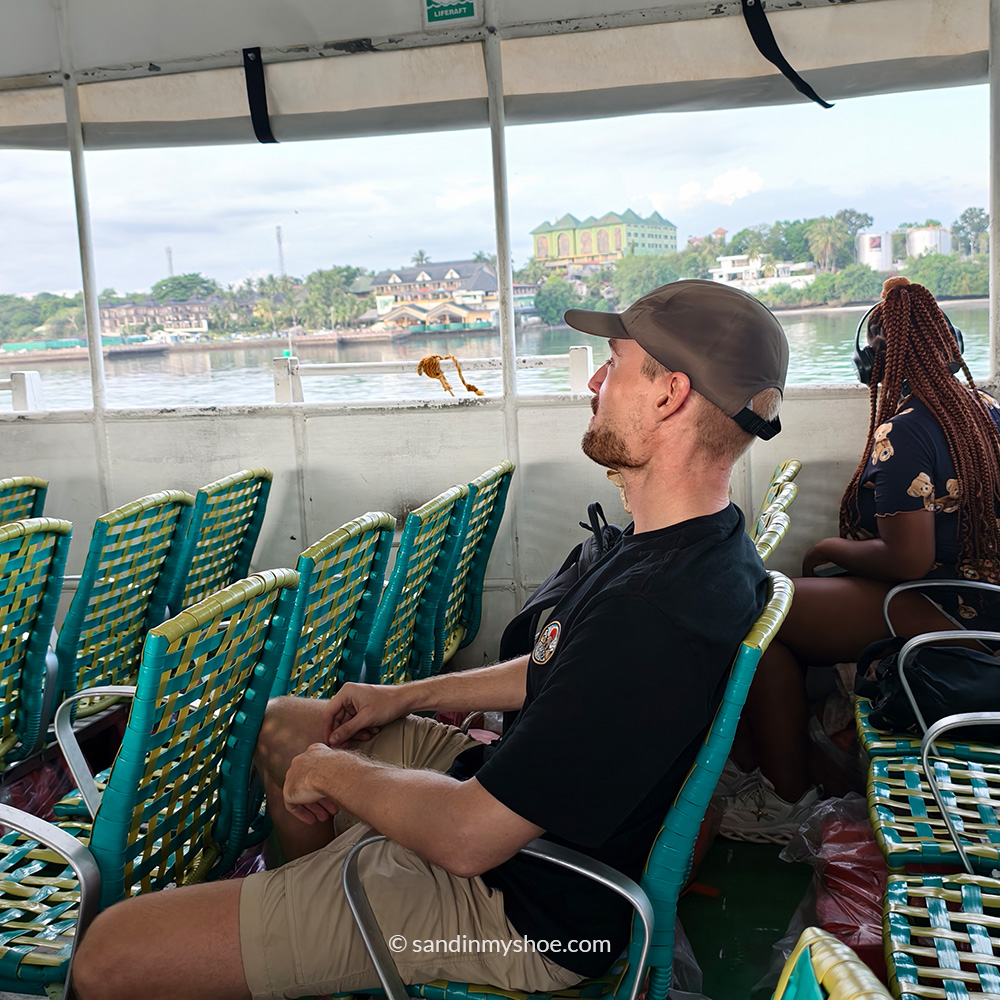 Petteri sitting in open-air top deck of a ferry traveling between Siquijor and Bohol