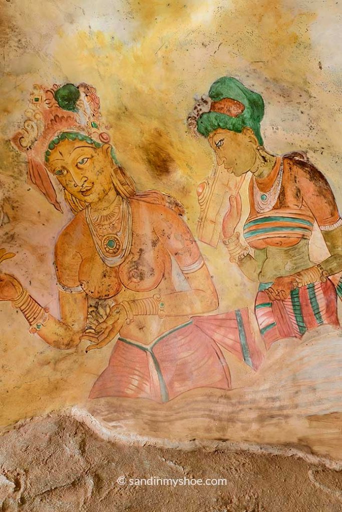 Cave paintings depicting two women