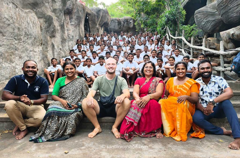Petteri posing with a whole primary class
