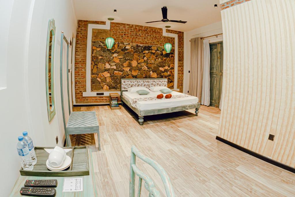 Double‑bed room at Still Waters Artistry with simple decor and natural light.