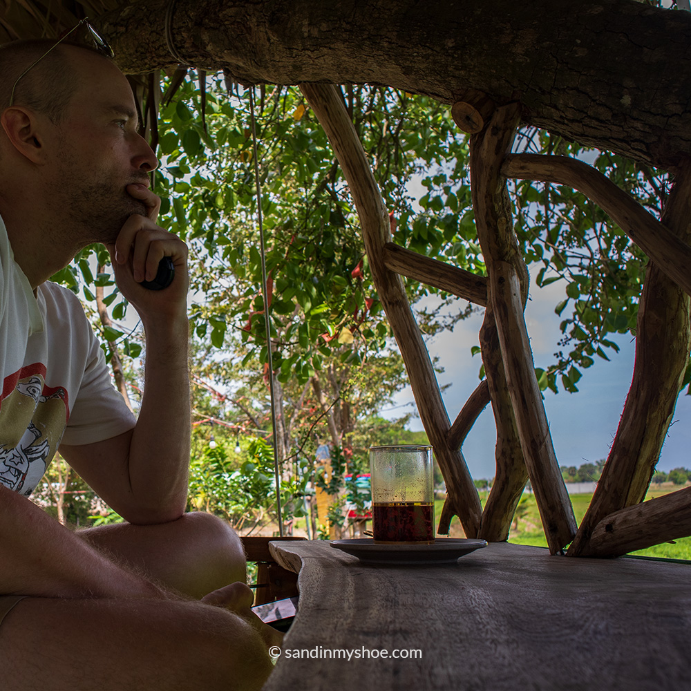 Petteri getting a coffee next to a rice field