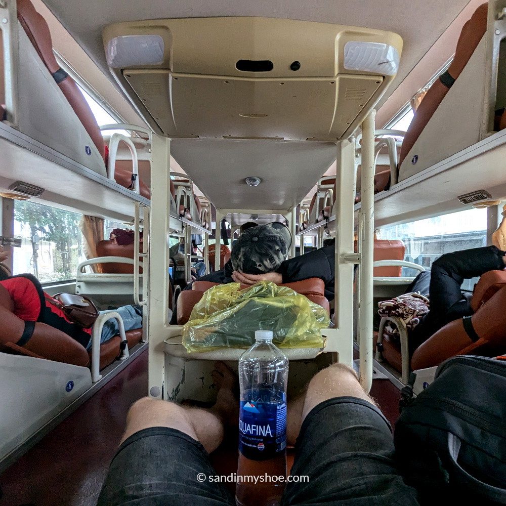 Petteri liying inside a sleeper bus in Vietnam