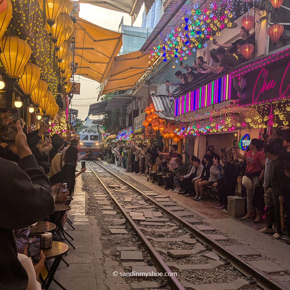 Train street in Hanoi with a train incoming