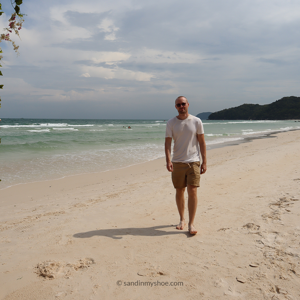 Petteri on a sandy beach in Phu Quoc, sketching out ideas for where to go in Vietnam.