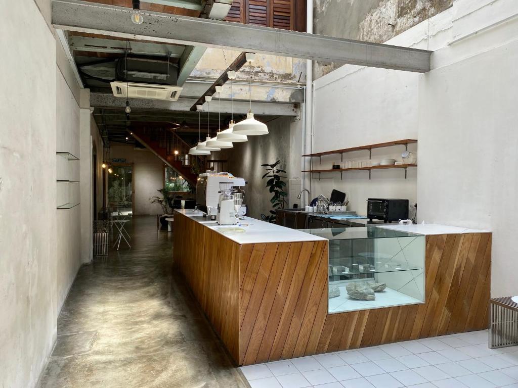 Ground‑floor café at The Frame Guesthouse, known for its popularity with guests and locals.