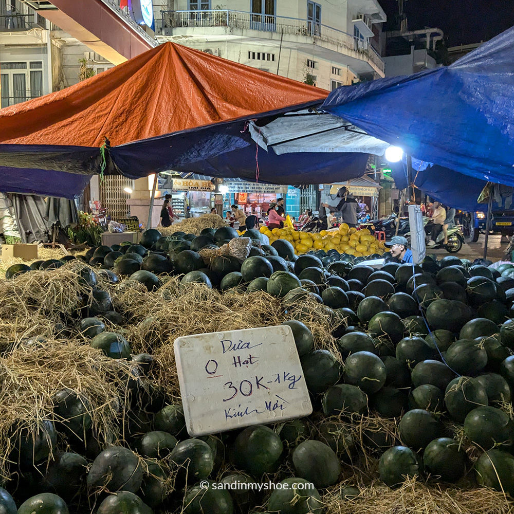Watermelon vendor at the Dam Market in the evening