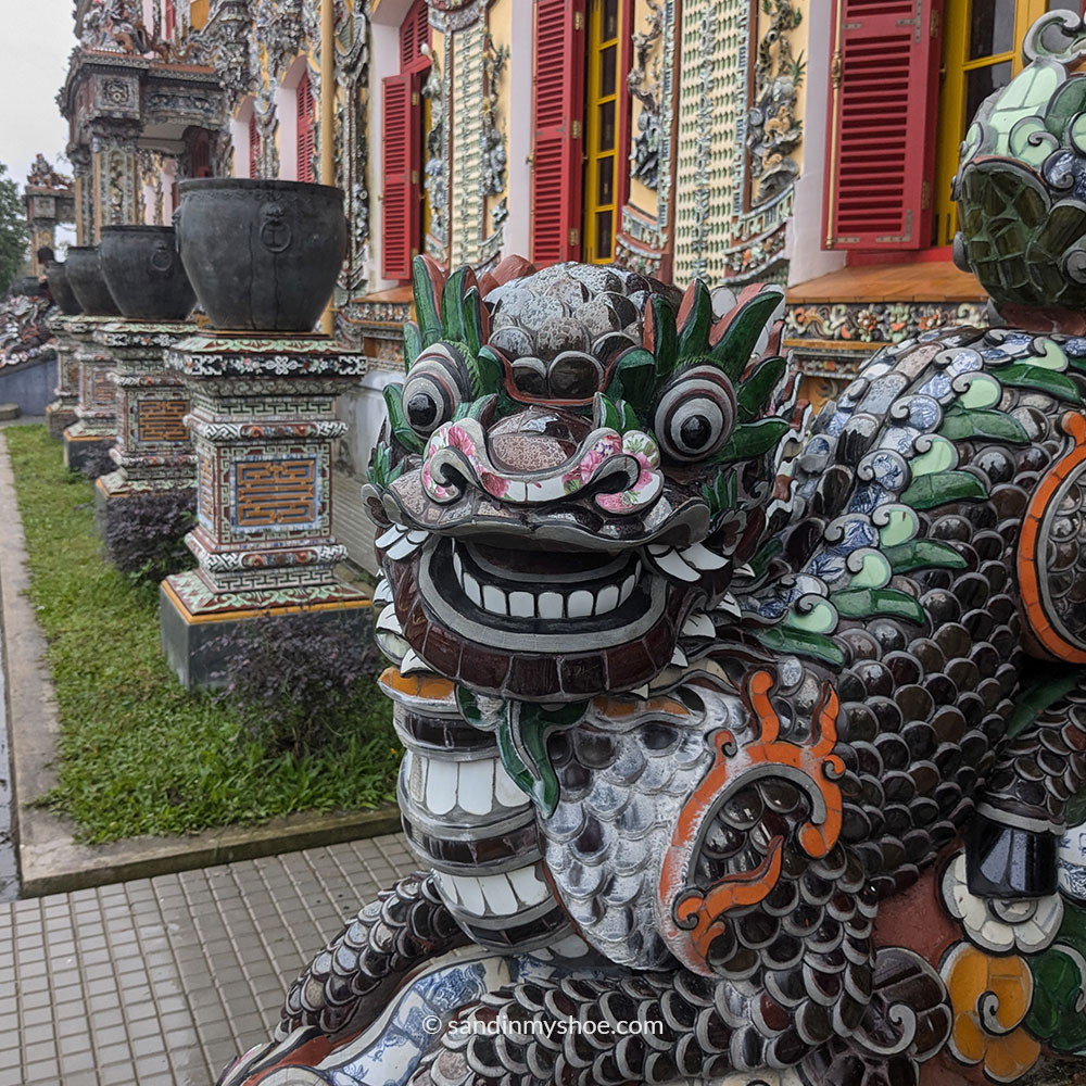 Ceramic dragon detail inside the Imperial City in Huế, made from colorful mosaic tiles.