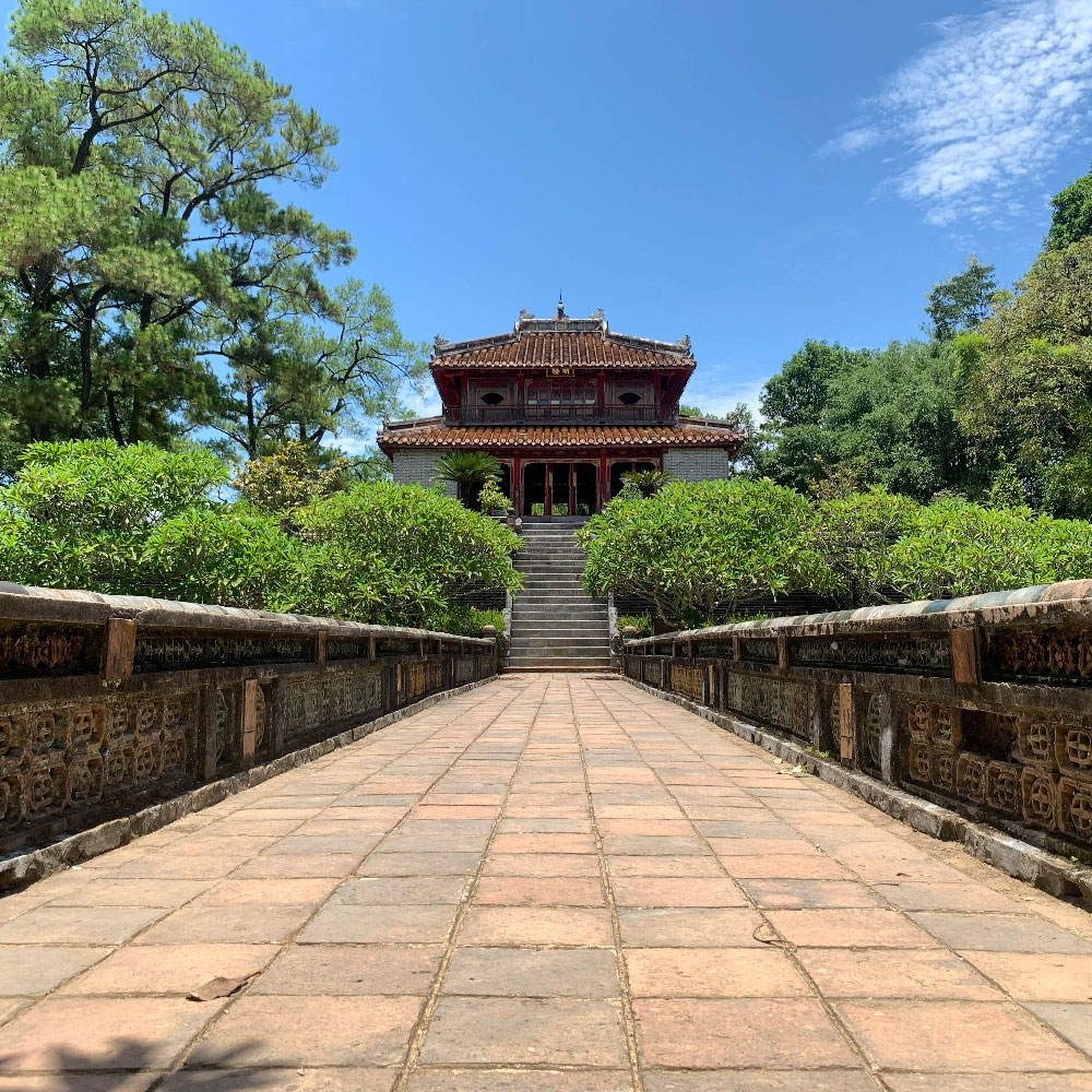 Minh Mạng Tomb in Huế with symmetrical courtyards, stone steps, and traditional Vietnamese architecture.