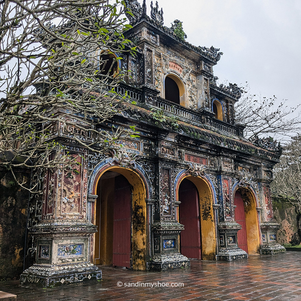 Main gate of the Imperial City in Huế with traditional architecture and layered roofs.