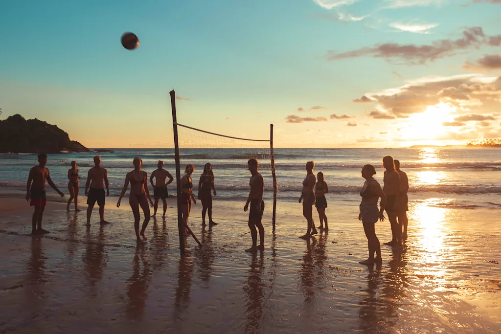 People playing beach volleybal on a beach in Arugam Bay.