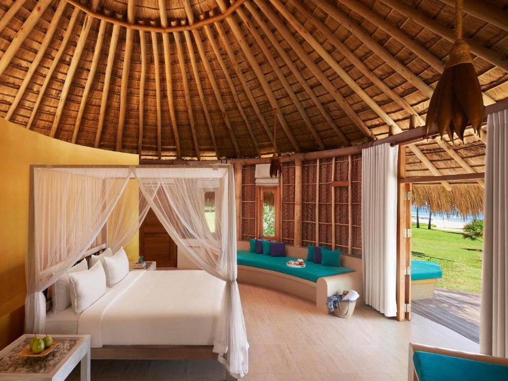 Interior of a Jetwing Surf & Safari room with views of the natural surroundings.