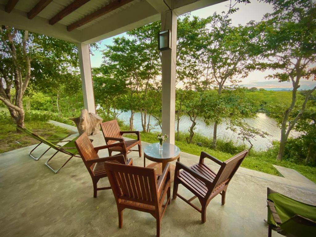 Room lounge area at Kudakalliya Beach House next to the river.
