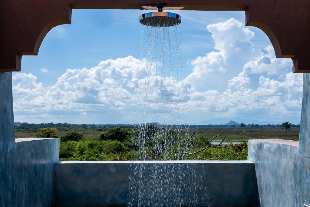 A shower with view of nature in Kudakalliya Beach Houses, outskirts of Arugam Bay.