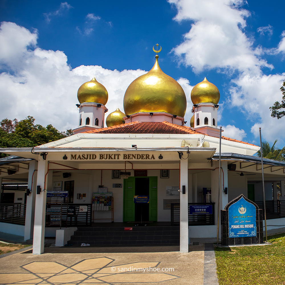 Simple, minimalist mosque on Penang Hill with clean architecture, white surfaces, and an uncluttered exterior.