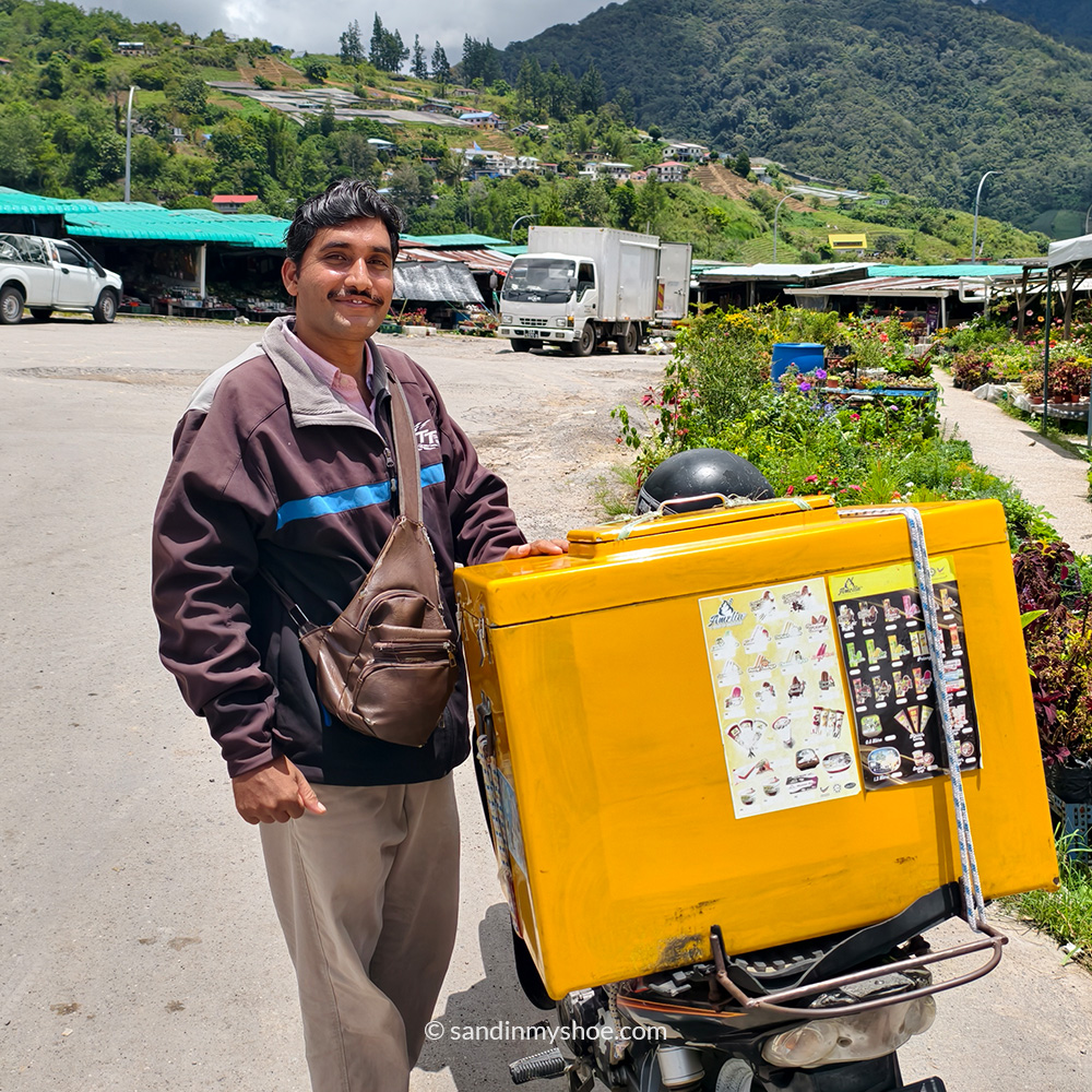 A local ice‑cream vendor selling from a motorbike in Kundasang.