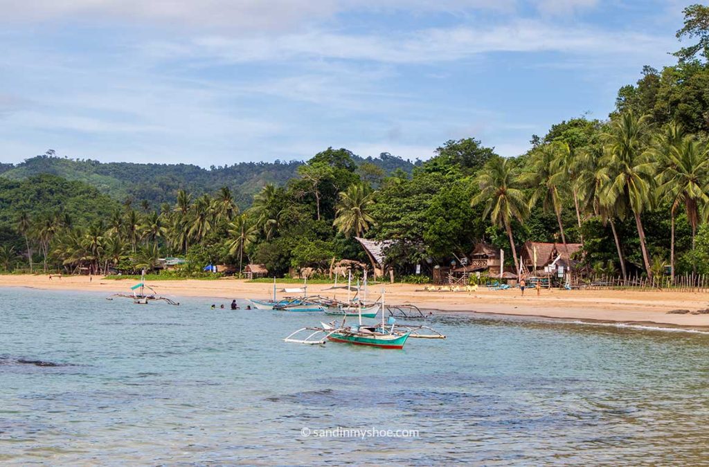 Duli beach with boats in the sea.
