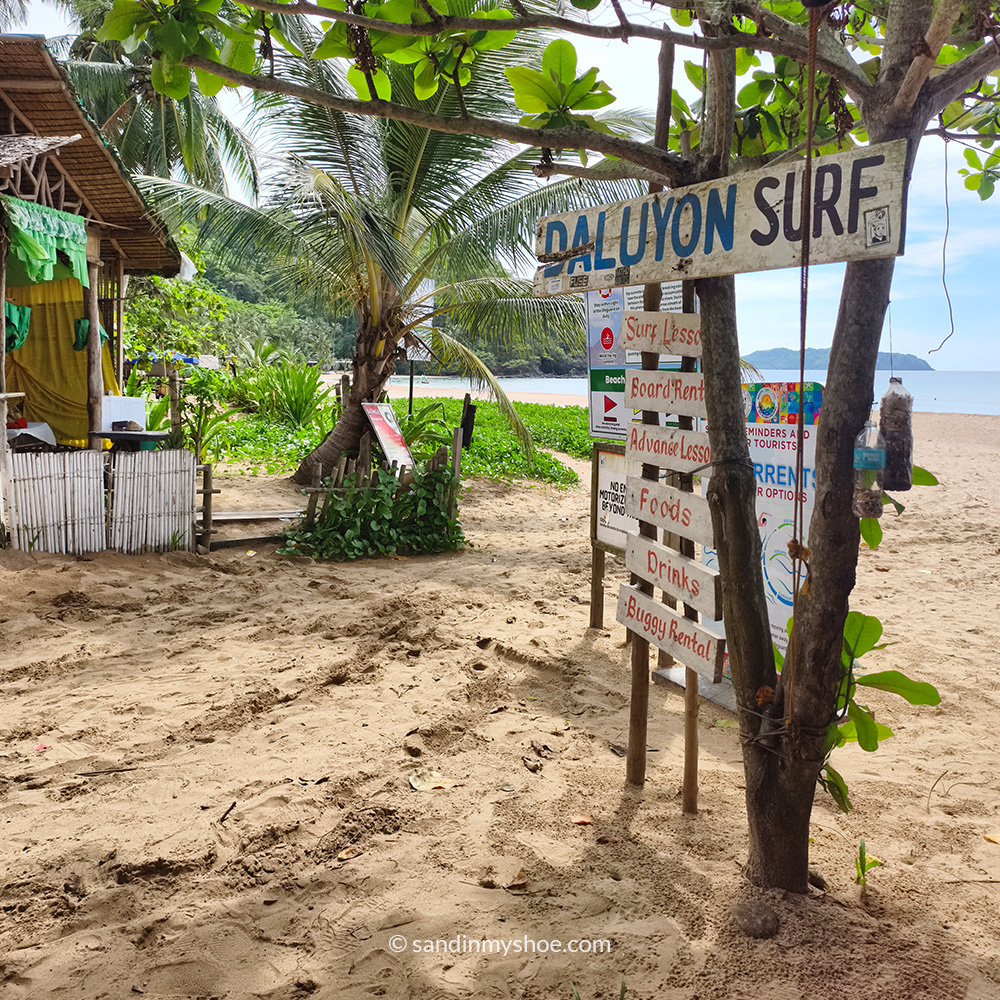 Sign about surfing in Duli Beach.