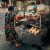 Woman preparing a bánh mì at a street stall in Vietnam.